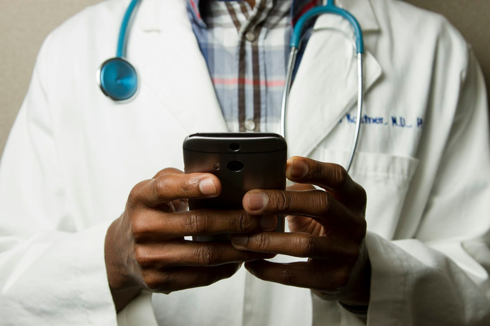 A clinician reviewing information on a secure device